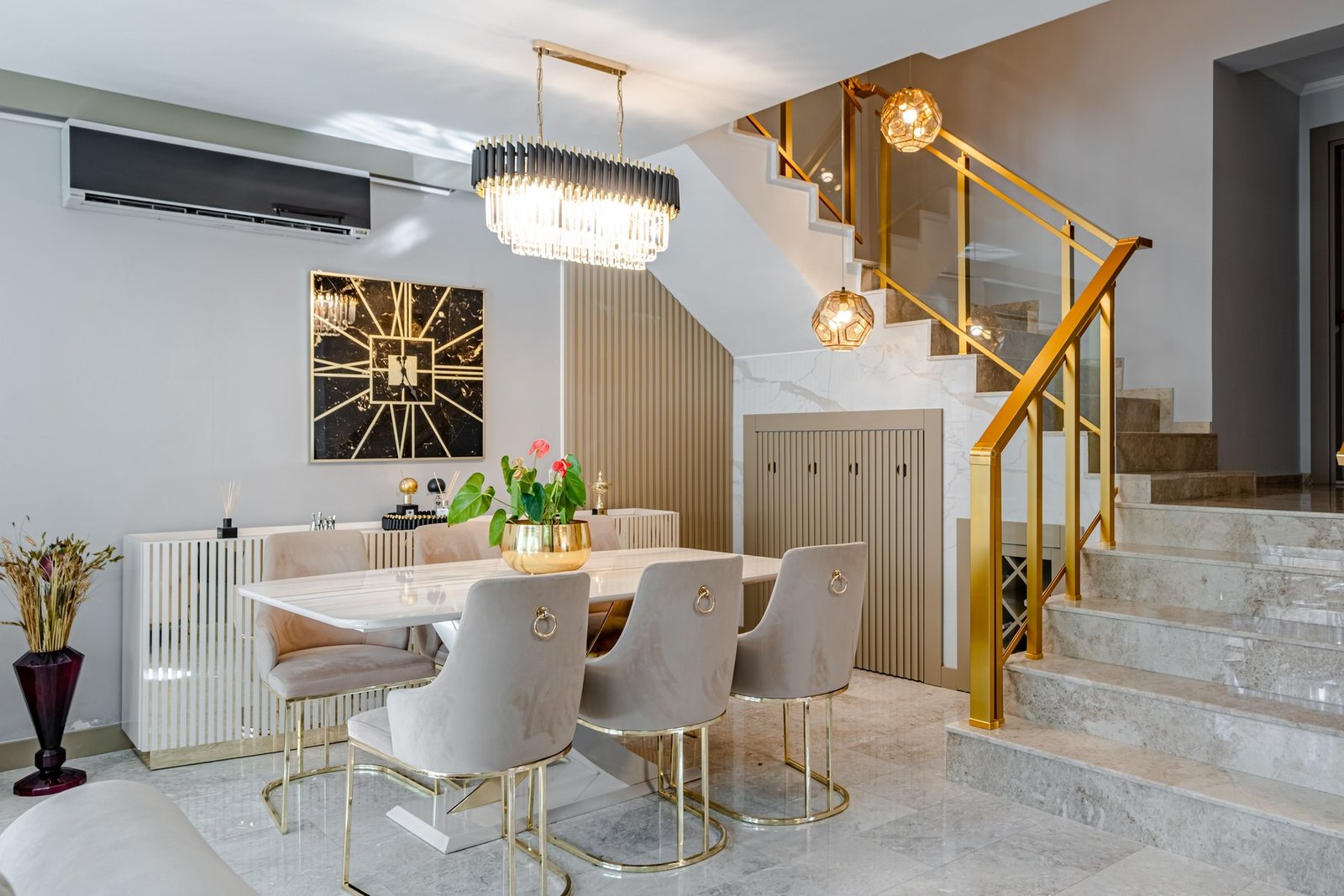 Dining — Gold glam staircase chandelier — Maitri Interior Studio project photo