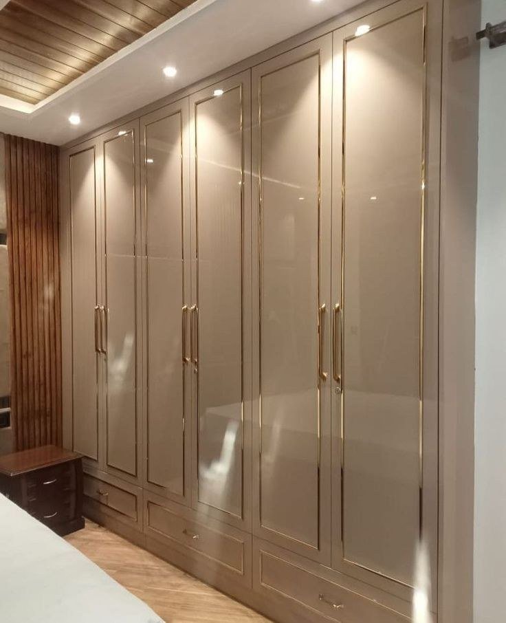 Wardrobe & Storage — Glossy beige gold trim — Maitri Interior Studio project photo