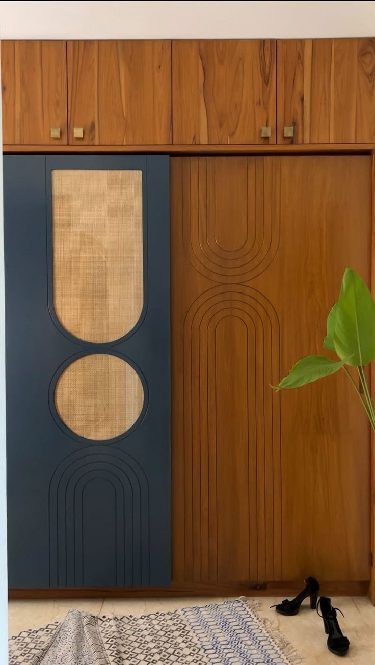 Wardrobe & Storage — Navy teak cane arch motif — Maitri Interior Studio project photo